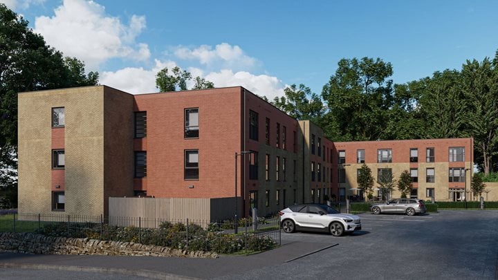 a brick building with cars parked in front of it