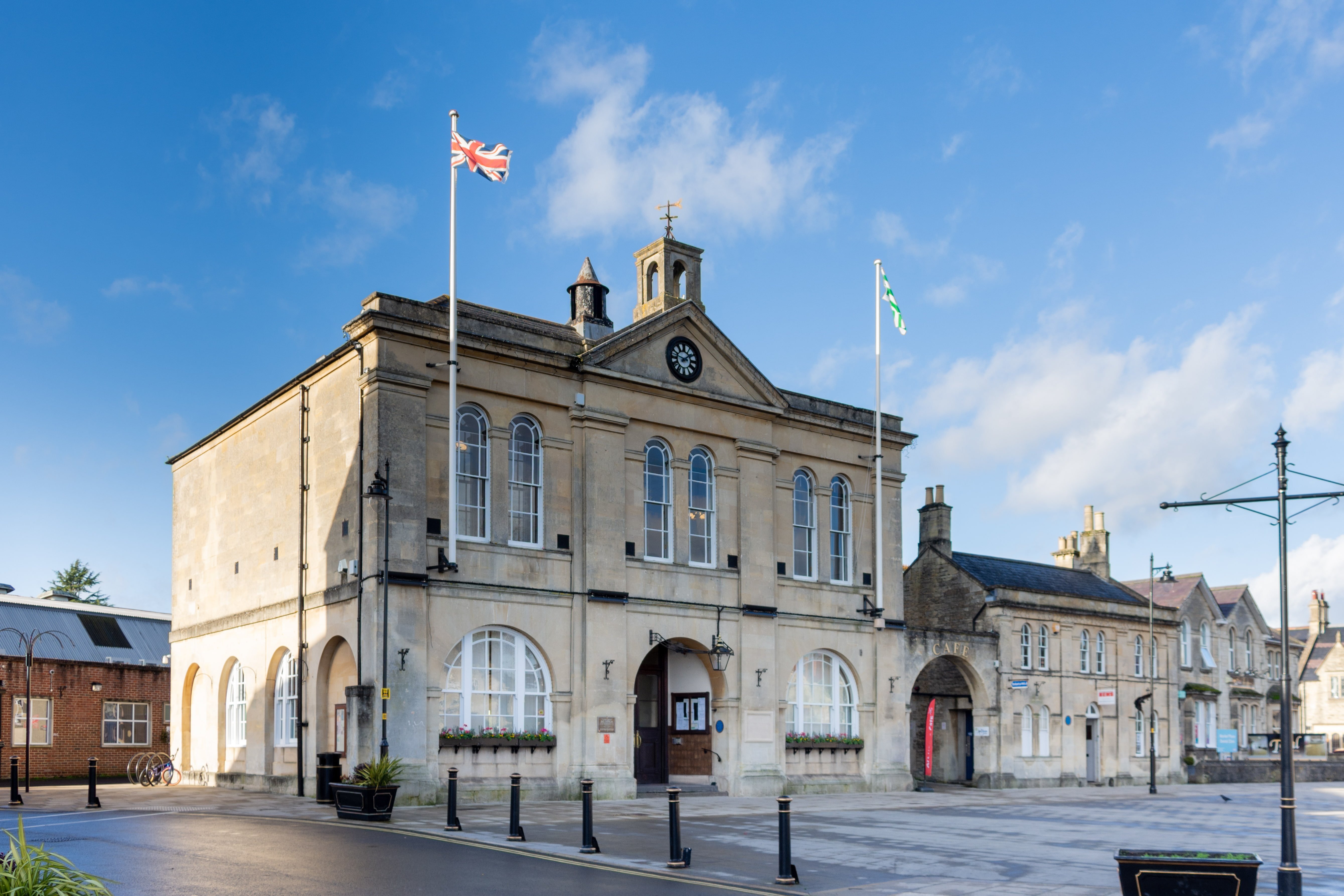 a large stone building with a flag on top