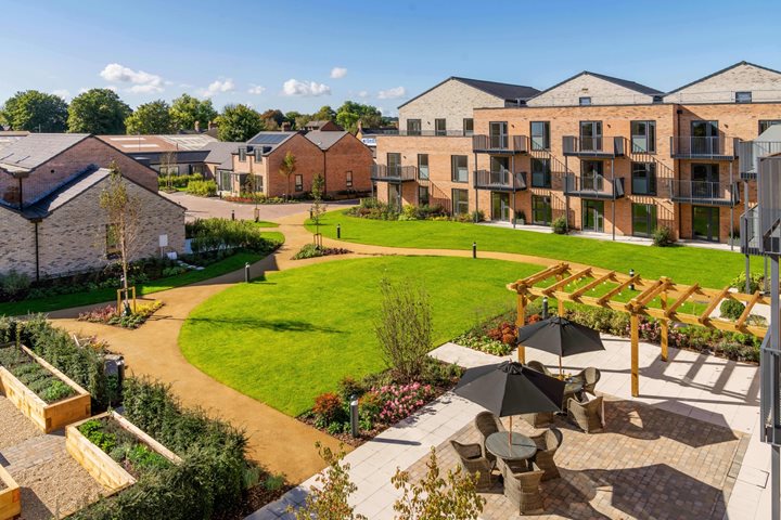 a courtyard with a building in the background