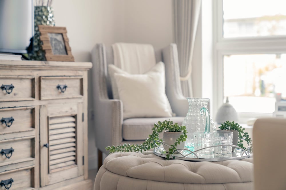 a living room with a white couch and a table