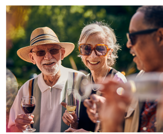 a group of people holding wine glasses