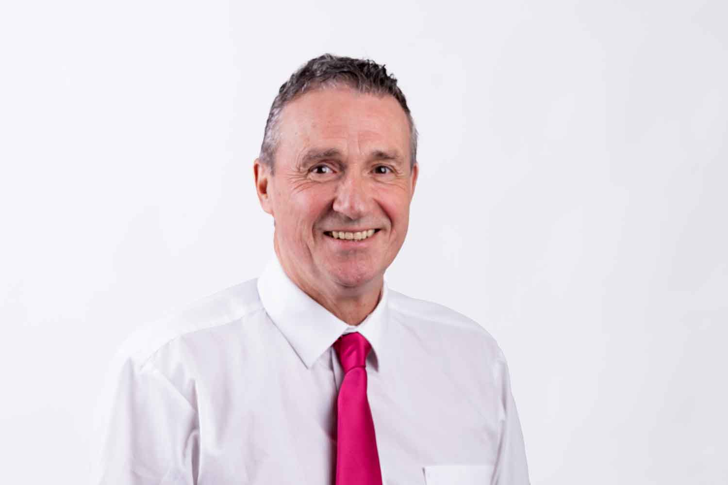 a man wearing a white shirt and red tie