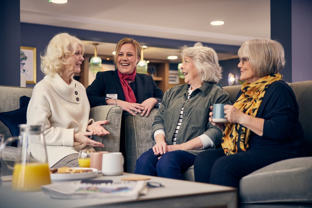 a group of women sitting in a room