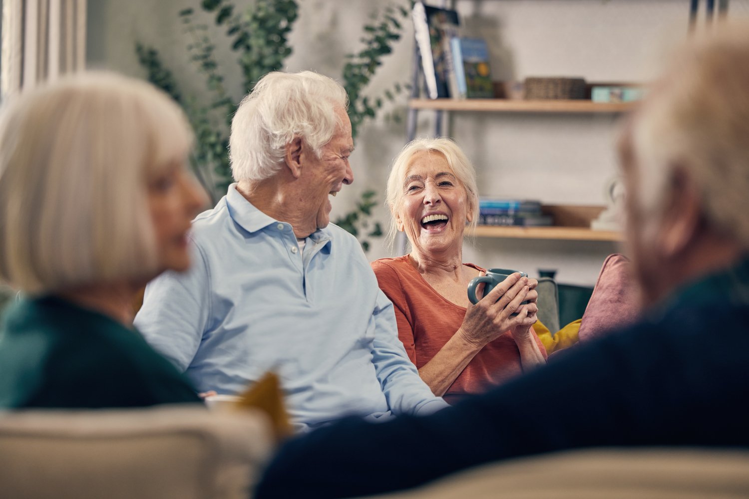 Older people enjoying coffee in the Communal Lounge at a Retirement Living Development