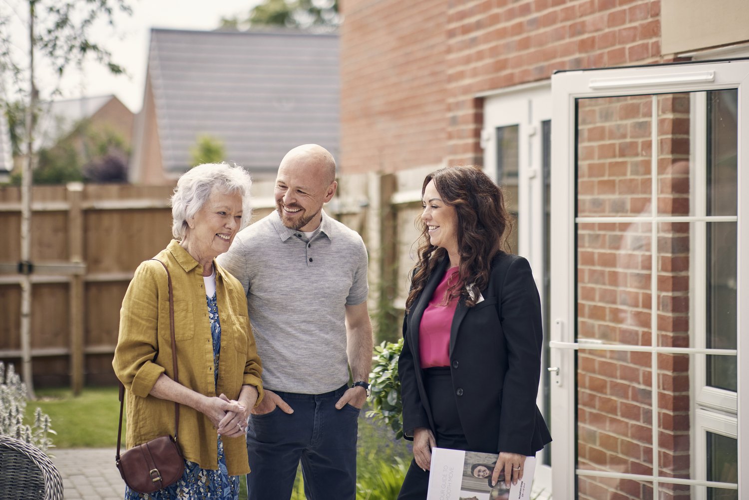 a group of people standing outside a house