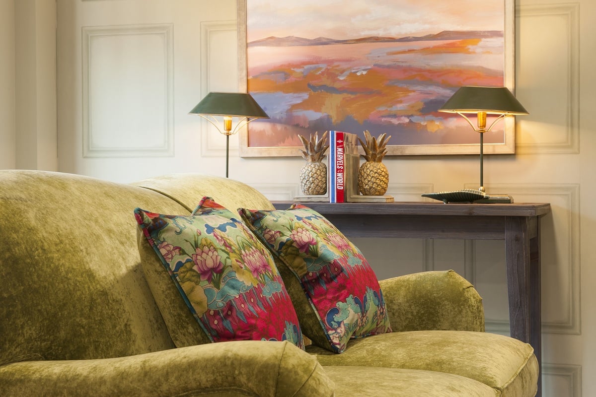 a couch with a colorful pillow