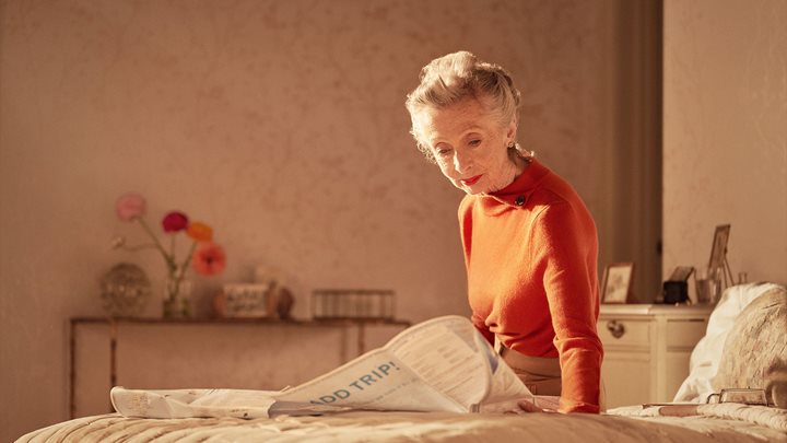Woman looking at paper map, McCarthy Stone