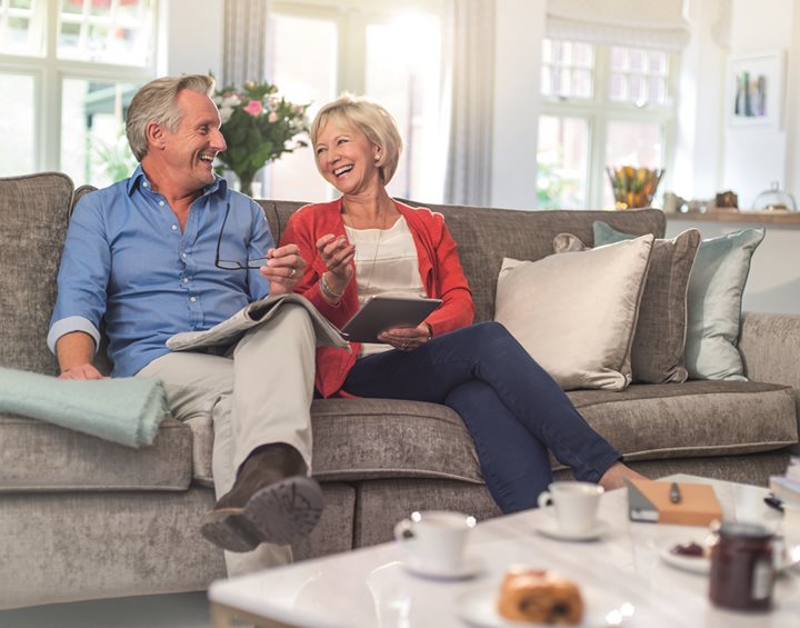 a man and a woman sitting on a couch