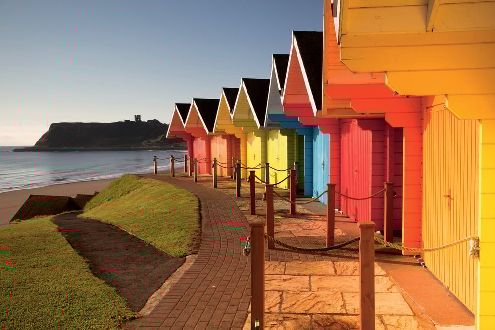 a row of colorful buildings by the water