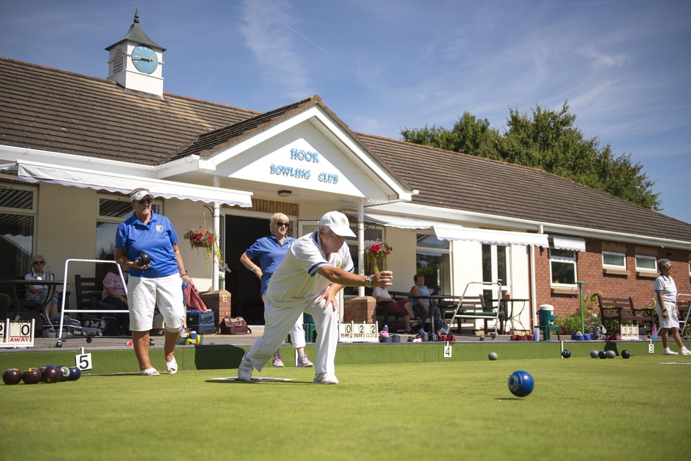 a group of people playing a game of golf