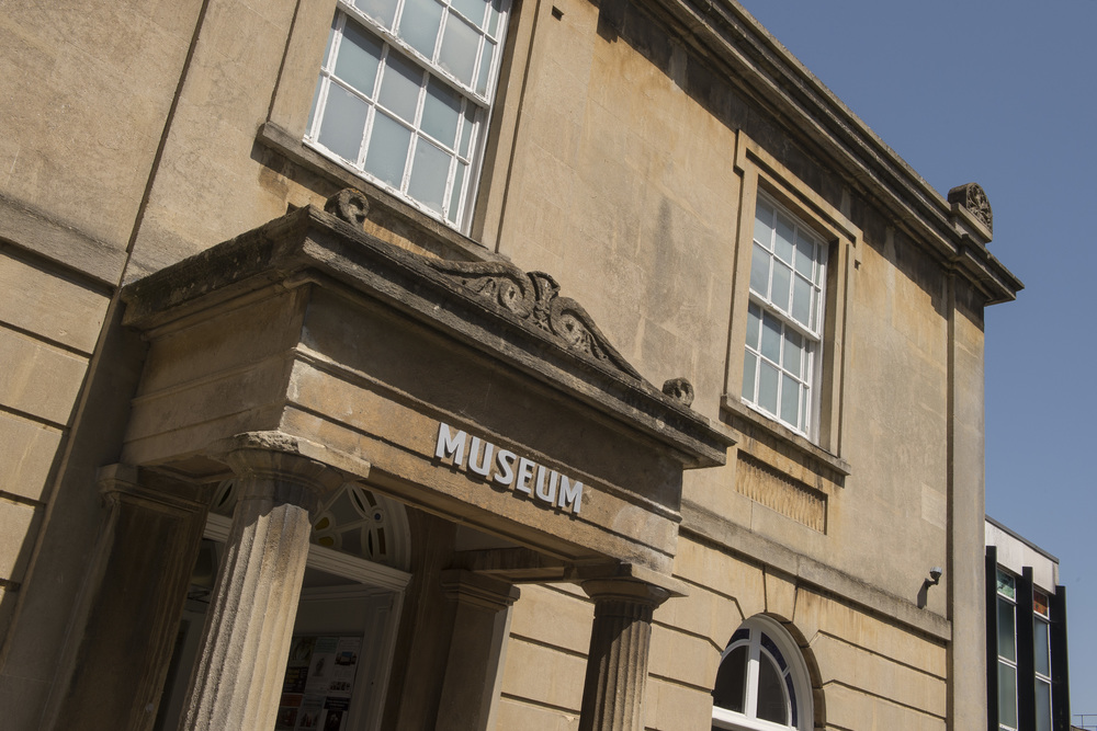 a building with windows and a sign on the front