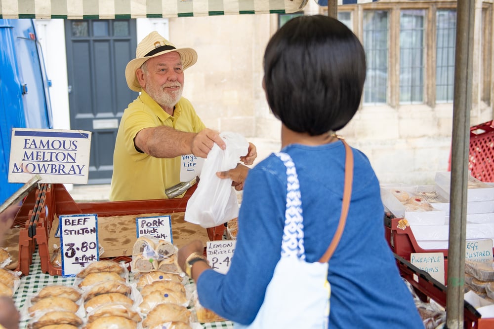 a man and a woman at a market