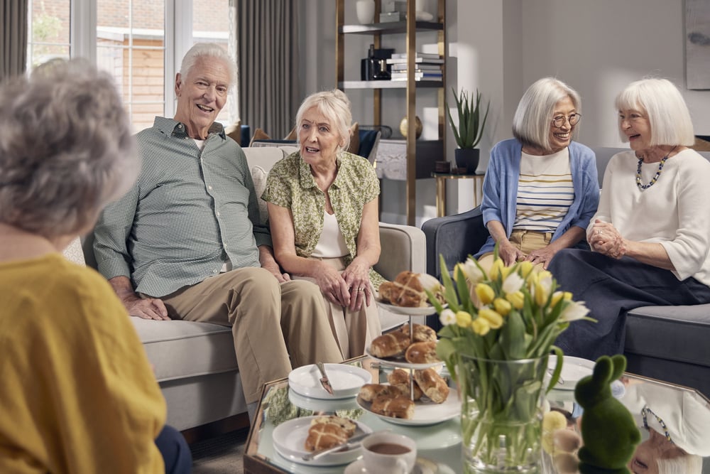 a group of elderly women sitting around a table