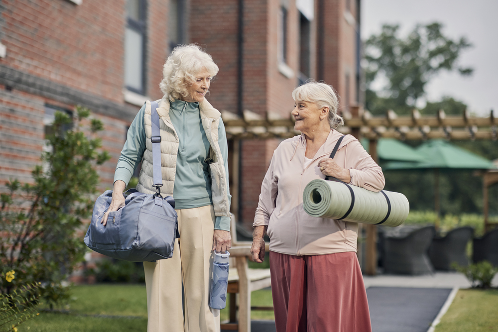 a couple of women walking