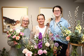 image of women holding flowers