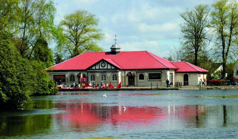 a house with a boat in the water