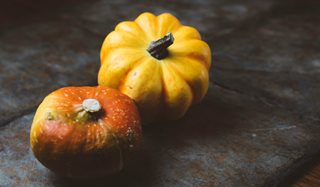 a couple of oranges with a face on them