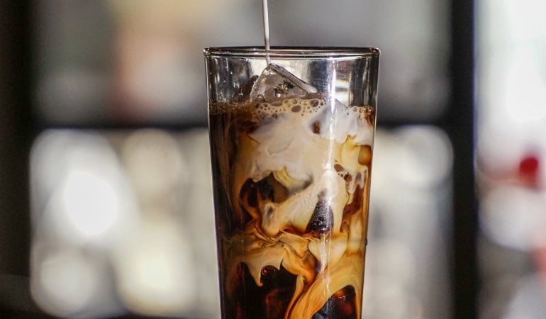 a glass with a liquid in it