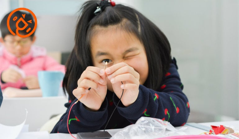 a girl with her hand on her face