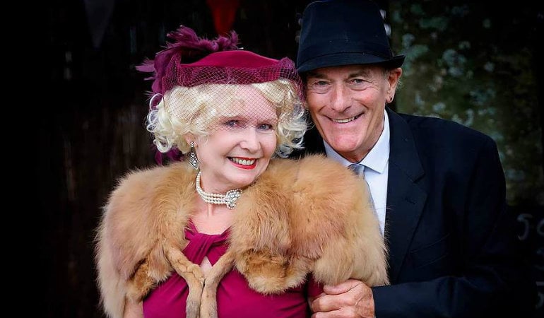 a man and woman smiling