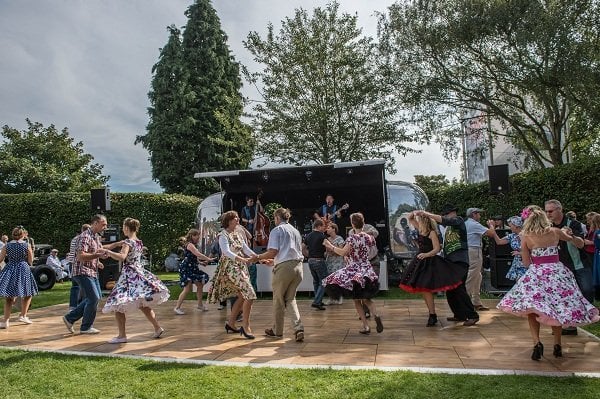 a group of people dancing on a stage
