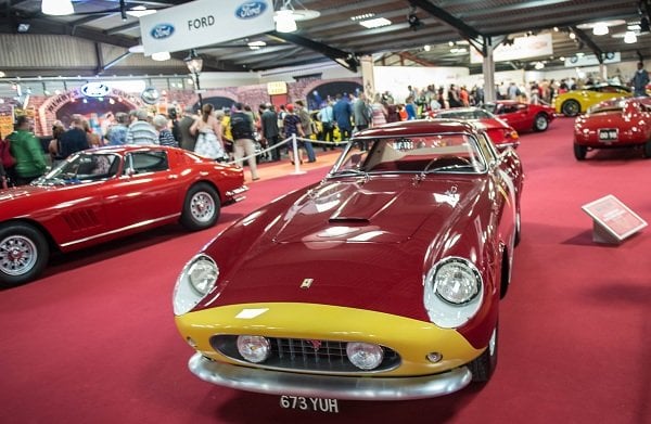 a group of cars in a showroom