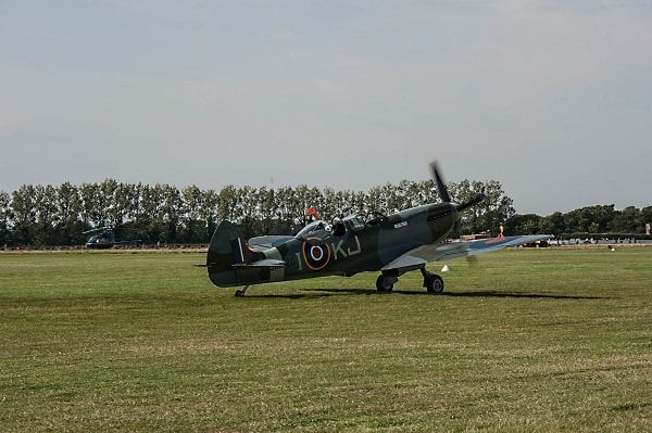 a military plane on a field