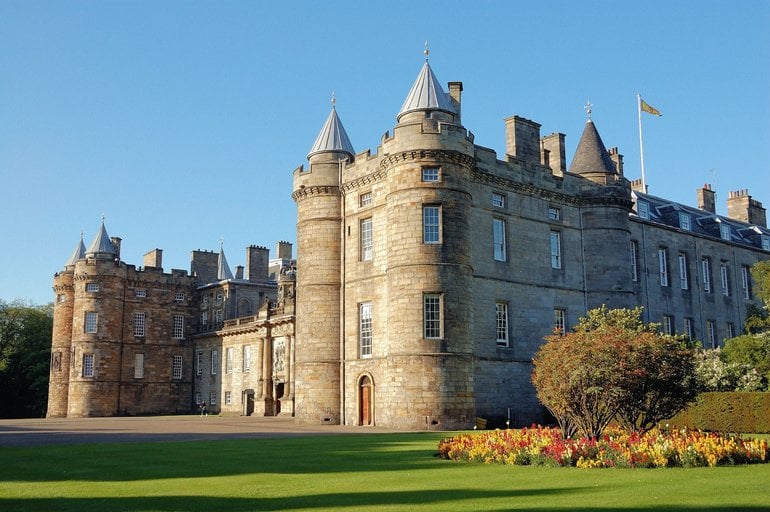 a large castle with a lawn