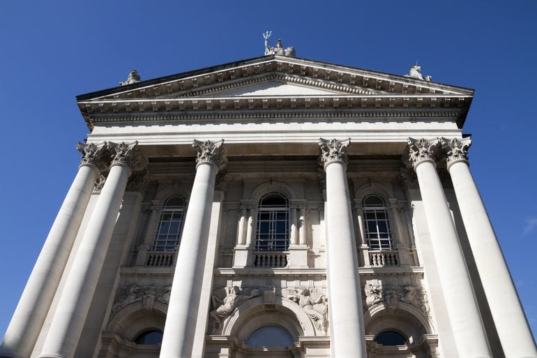 Tate Britain with columns and a statue