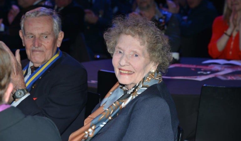a woman and a man sitting at a table