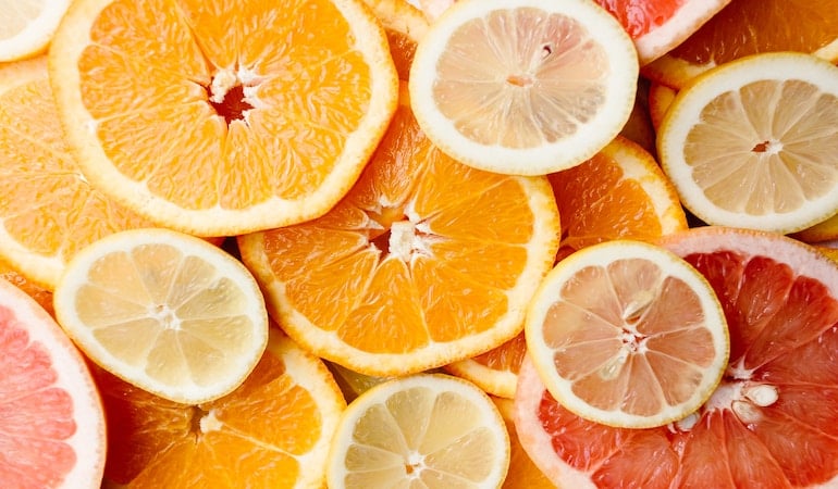 a group of oranges sliced in half
