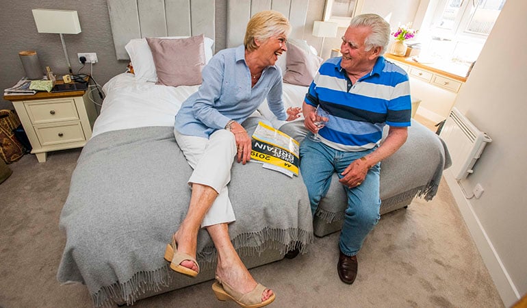 a man and a woman sitting on a couch