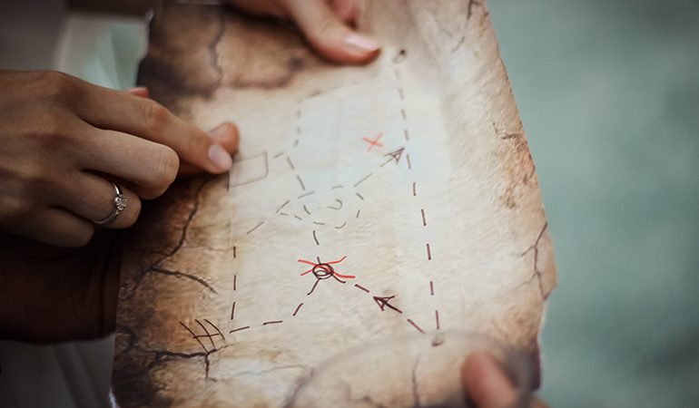 a person writing on a piece of paper