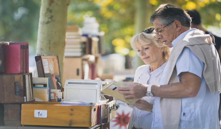a man and a woman looking at a piece of paper