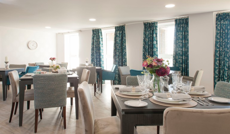 a dining room with a table set
