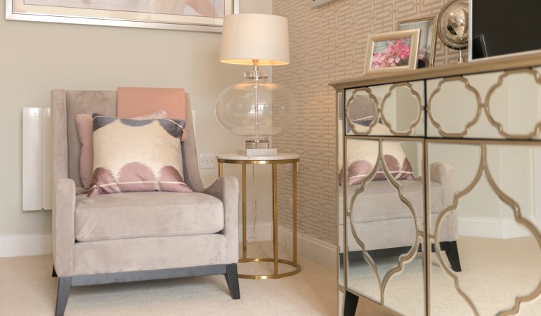 a room with a couch and a lamp