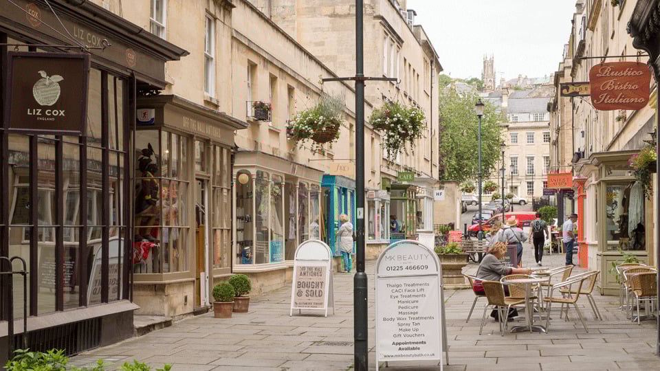 a street with buildings and people