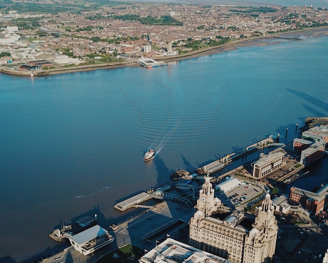 Aerial shot over Liverpool and the Mersey river