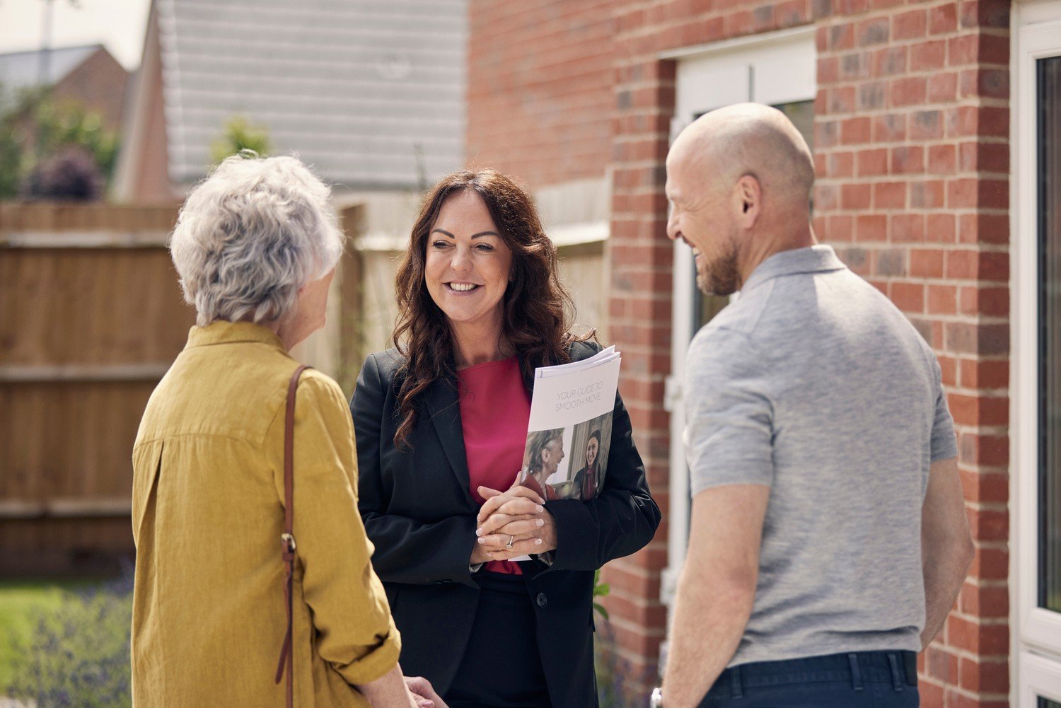 A McCarthy Stone employee and resident discussing what benefits pensioners can claim