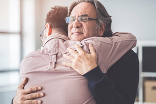 Father and son hugging