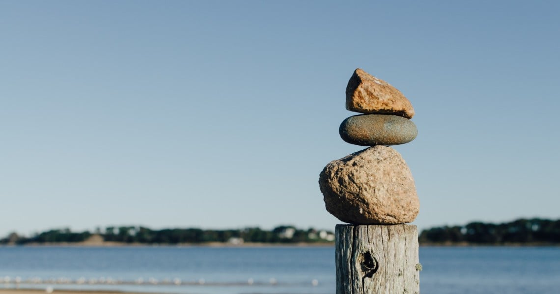 a stack of rocks on a post