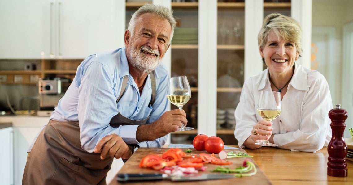 a man and a woman holding wine glasses