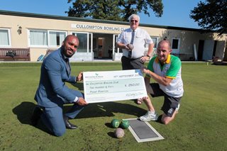 Brian Clements accepting cheque