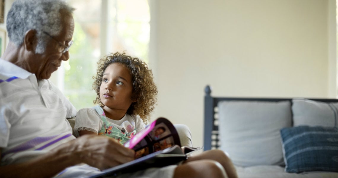 a woman and a child looking at a book