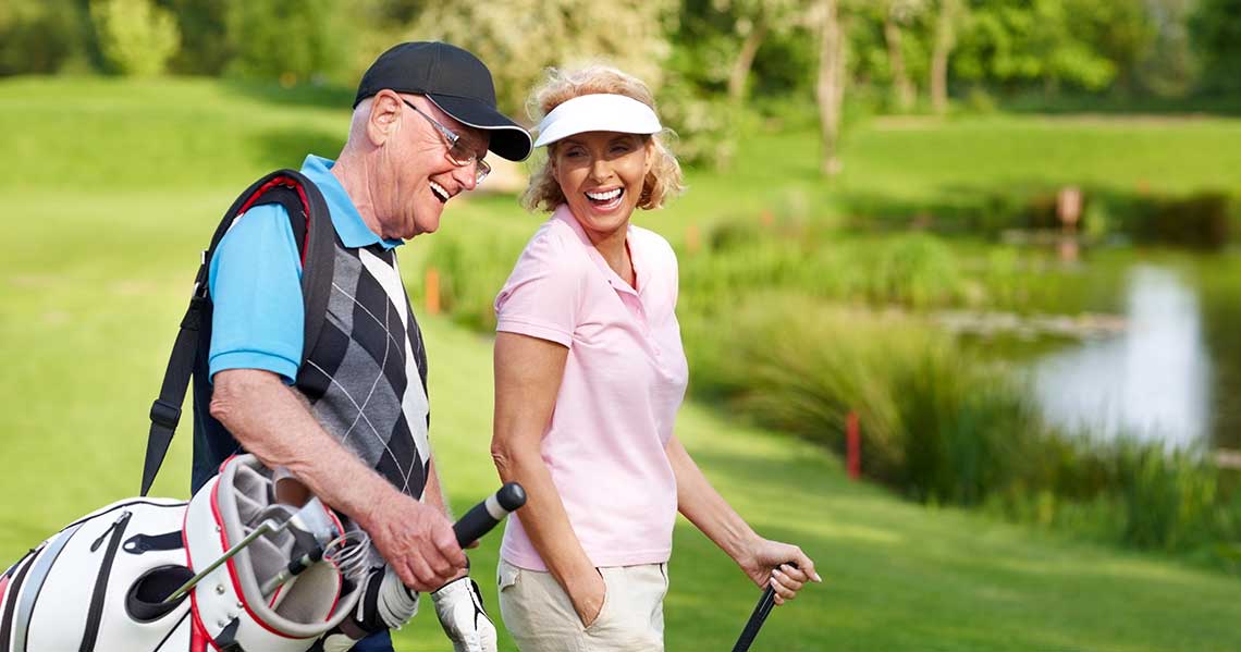 a man and woman on a golf course