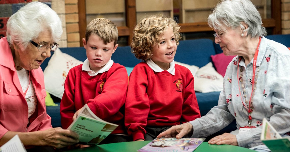 a person and a child reading a book