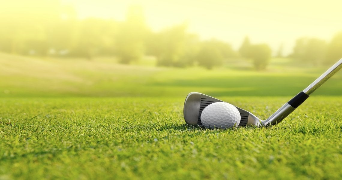 a golf club on grass