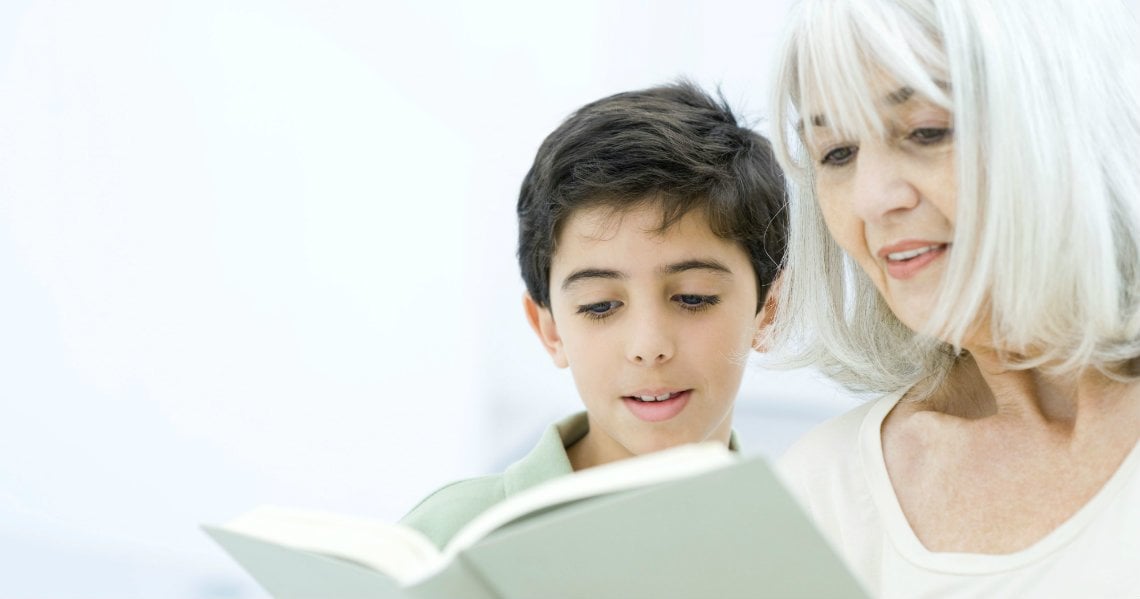 a woman and a boy looking at the camera