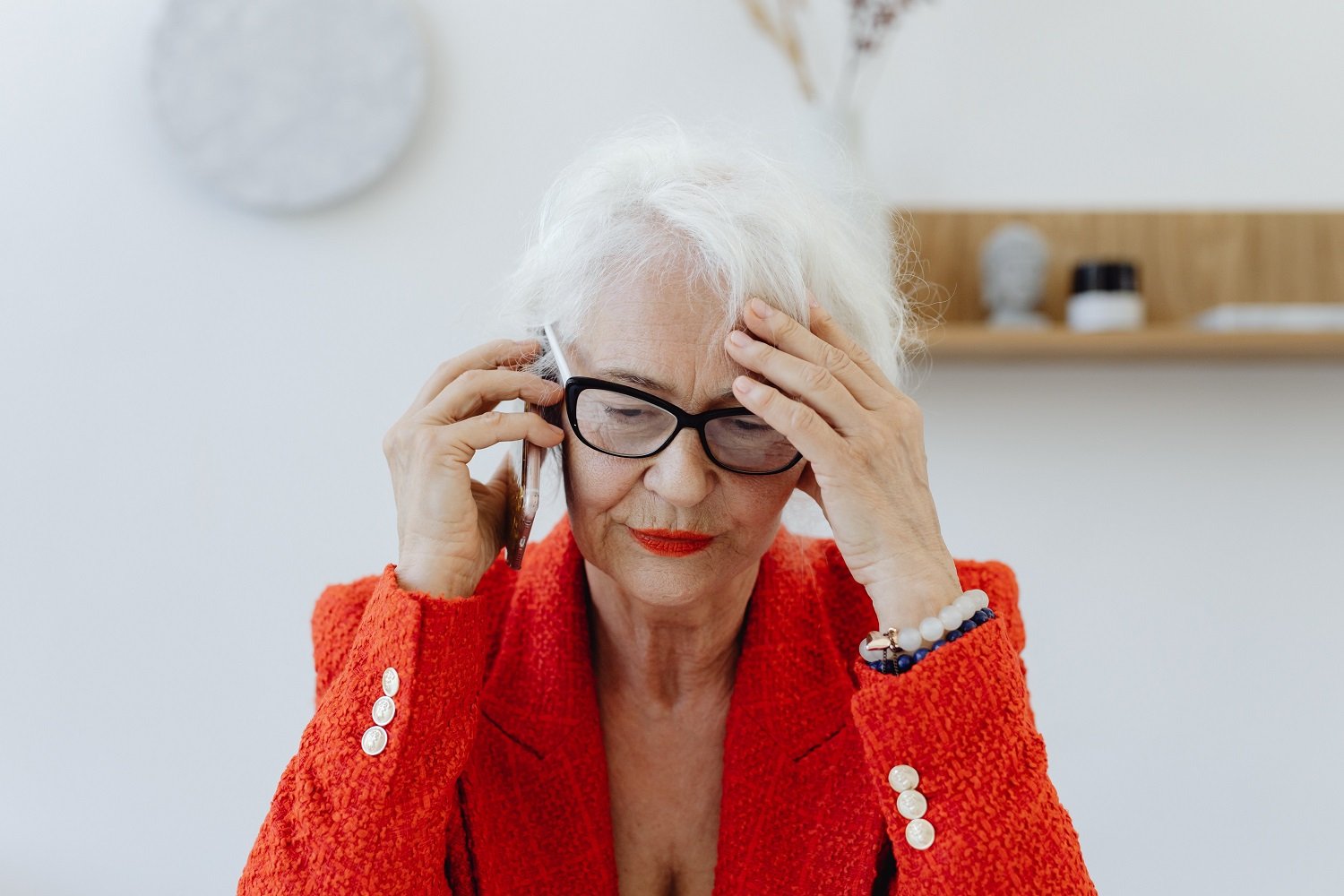 Woman in red jacket on the phone