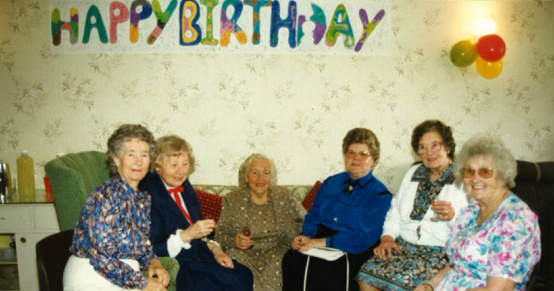 a group of people posing for a photo